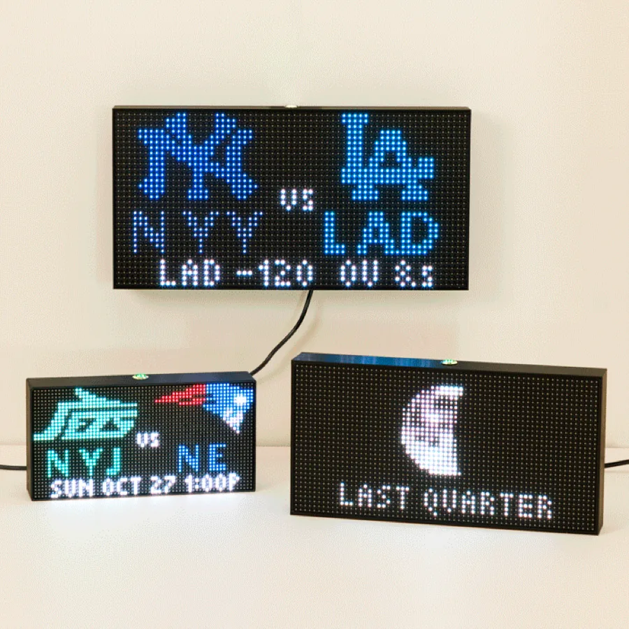 UncommonGoods Personalized Home LED Ticker displaying a live sports score on a desktop LED panel