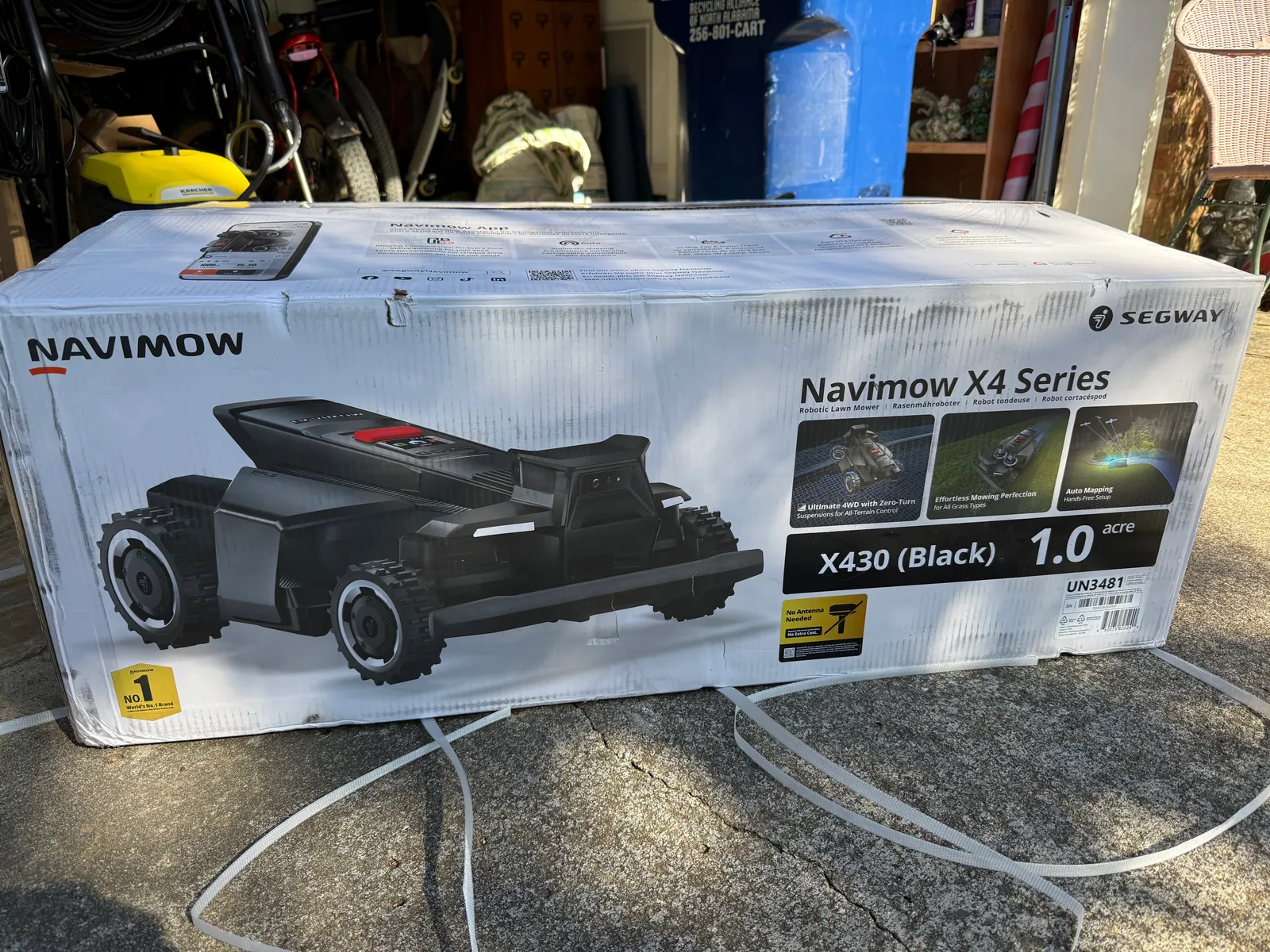 Segway Navimow X430 retail packaging in Rob's garage on arrival day — Navimow X4 Series box labelled 'X430 (Black) 1.0 acre'
